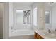 Bright bathroom with a bathtub, marble countertops, and modern fixtures at 1351 Fawn St, Pahrump, NV 89048