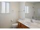 Bathroom with a white vanity, marble countertops, and a walk-in shower at 1351 Fawn St, Pahrump, NV 89048