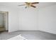 Spacious bedroom features a ceiling fan, neutral walls, and carpet flooring at 1351 Fawn St, Pahrump, NV 89048