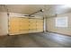 Spacious garage with a large door and window for natural light at 1351 Fawn St, Pahrump, NV 89048