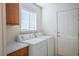 Practical laundry room with washer, dryer, and storage space at 1351 Fawn St, Pahrump, NV 89048