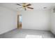 Neutral bedroom with ceiling fan leading to the ensuite bathroom at 1351 Fawn St, Pahrump, NV 89048