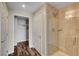 Bathroom view features a marble tiled shower and a doorway to a walk-in closet at 150 N Las Vegas Blvd # 804, Las Vegas, NV 89101