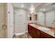 Bathroom showcasing double sinks, granite countertops, and marble shower at 150 N Las Vegas Blvd # 804, Las Vegas, NV 89101