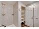 Tiled shower with dual shower heads plus built-in shelving and closet access at 150 N Las Vegas Blvd # 804, Las Vegas, NV 89101