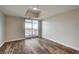 Bright bedroom features wood floors, neutral walls, and balcony access at 150 N Las Vegas Blvd # 804, Las Vegas, NV 89101