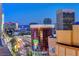 A vibrant city view showcasing the Stratosphere Tower and bustling streets at night at 150 N Las Vegas Blvd # 804, Las Vegas, NV 89101