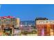 Wide angle view of downtown cityscape at night, featuring hotels and nearby mountain range at 150 N Las Vegas Blvd # 804, Las Vegas, NV 89101