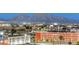 Distant mountain views beyond the lit city streets framed with palm trees and commercial buildings at 150 N Las Vegas Blvd # 804, Las Vegas, NV 89101
