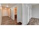 Spacious hallway featuring wood-look floors, neutral walls, and access to bathroom and bedrooms at 150 N Las Vegas Blvd # 804, Las Vegas, NV 89101