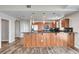 This modern kitchen features granite countertops, stainless steel appliances, and a breakfast bar overlooking the living area at 150 N Las Vegas Blvd # 804, Las Vegas, NV 89101