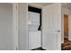 Laundry closet with stackable washer and dryer units with vented doors at 150 N Las Vegas Blvd # 804, Las Vegas, NV 89101