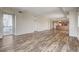 Bright open-concept living space featuring wood-look floors and access to a private balcony with city views at 150 N Las Vegas Blvd # 804, Las Vegas, NV 89101