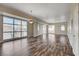 Large living room area featuring wood floors, large windows and white walls with bright natural light at 150 N Las Vegas Blvd # 804, Las Vegas, NV 89101