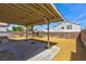 Spacious backyard featuring a covered patio and low-maintenance landscaping with a brick wall at 1724 Navajo Lake Way, Las Vegas, NV 89128