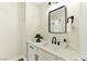 Powder room featuring a white vanity with modern fixtures at 1724 Navajo Lake Way, Las Vegas, NV 89128