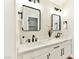 Bathroom featuring double sinks, framed mirrors, and modern fixtures at 1724 Navajo Lake Way, Las Vegas, NV 89128