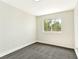 Bedroom featuring neutral walls, carpeted floors, and a window at 1724 Navajo Lake Way, Las Vegas, NV 89128