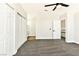 Spacious bedroom featuring a ceiling fan, closet doors, and access to a bathroom at 1724 Navajo Lake Way, Las Vegas, NV 89128