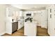Updated kitchen featuring white cabinets, stainless steel appliances, and an island with countertop at 1724 Navajo Lake Way, Las Vegas, NV 89128