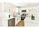 Updated kitchen featuring white cabinets, stainless steel appliances, and an island with countertop at 1724 Navajo Lake Way, Las Vegas, NV 89128