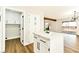 Open-concept view of white kitchen island with modern appliances and plenty of cabinet space at 1724 Navajo Lake Way, Las Vegas, NV 89128