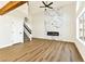 Bright and airy living room features wood floors, modern fireplace and staircase at 1724 Navajo Lake Way, Las Vegas, NV 89128