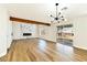 Open living room with wood floors, modern fireplace, and sliding glass door at 1724 Navajo Lake Way, Las Vegas, NV 89128
