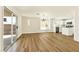 Open concept layout featuring wood floors and large sliding glass door with access to backyard at 1724 Navajo Lake Way, Las Vegas, NV 89128