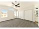 Main bedroom with vaulted ceiling, ceiling fan, and double door closet at 1724 Navajo Lake Way, Las Vegas, NV 89128