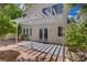 Outdoor patio with a pergola, landscaping, pavers, and a sliding glass door at 1812 Relate Ct, Las Vegas, NV 89117