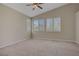 Bright and airy bedroom featuring plush carpeting, a ceiling fan and large windows at 1812 Relate Ct, Las Vegas, NV 89117