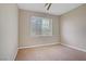Neutral bedroom featuring plush carpeting, and a window providing natural light at 1812 Relate Ct, Las Vegas, NV 89117