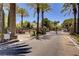 Gated entrance to a well-manicured community with mature landscaping and palm trees at 1812 Relate Ct, Las Vegas, NV 89117