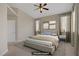 Staged main bedroom showcasing a comfortable bed, modern decor, and ample natural light at 1812 Relate Ct, Las Vegas, NV 89117