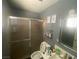 A full bathroom featuring a glass-enclosed shower and contemporary fixtures at 1841 Skywood Way, Las Vegas, NV 89142