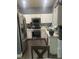 A well-lit kitchen featuring updated appliances and ample cabinet space at 1841 Skywood Way, Las Vegas, NV 89142