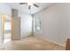 Neutral bedroom offers comfortable space with closet, window and ceiling fan at 1933 Davina St, Henderson, NV 89074