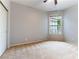 Bedroom featuring neutral carpet and a large window overlooking the exterior at 1933 Davina St, Henderson, NV 89074