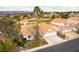A beautiful home with a two-car garage, complemented by lush greenery and nestled in a serene neighborhood at 1933 Davina St, Henderson, NV 89074
