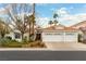 Charming single-story home with a three-car garage, mature trees, and desert landscaping at 1933 Davina St, Henderson, NV 89074