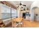 Charming kitchen with breakfast nook, ceiling fan, and plenty of natural light from large window at 1933 Davina St, Henderson, NV 89074