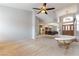 Open-concept living room with plush carpeting and seamless flow into dining areas at 1933 Davina St, Henderson, NV 89074