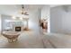 Spacious living room featuring plush carpeting, a fireplace, and large windows for natural light at 1933 Davina St, Henderson, NV 89074