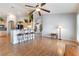 Cozy living area with hardwood floors, open to the breakfast bar and kitchen at 1933 Davina St, Henderson, NV 89074