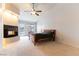 Spacious primary bedroom features a fireplace, ceiling fan, and access to outdoor pool at 1933 Davina St, Henderson, NV 89074