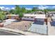 Aerial view of a single-story home featuring a carport, fresh exterior paint, and a secure gated front yard at 2016 Linden Ave, Las Vegas, NV 89101