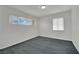 Bright bedroom with large windows and neutral gray carpeting at 2016 Linden Ave, Las Vegas, NV 89101
