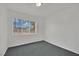 Sunlit bedroom featuring carpet and a large window with outside views at 2016 Linden Ave, Las Vegas, NV 89101