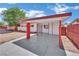 Spacious carport area providing covered parking and stylish architectural detail with a secured gate at 2016 Linden Ave, Las Vegas, NV 89101